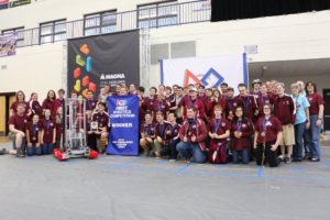 Team photo with our robot, trophy and winner banner
