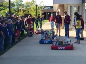 A crowd gathers to see the FRC robots in action.