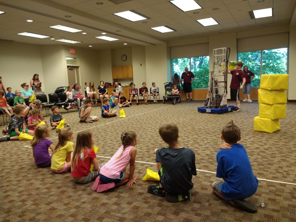 kids intently watching our robot demo